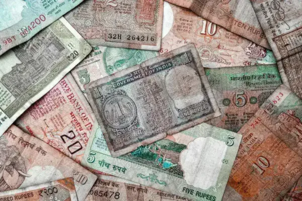 Indian Rupee Plummets to Record Low Amid Soaring Dollar Demand and Crude Prices