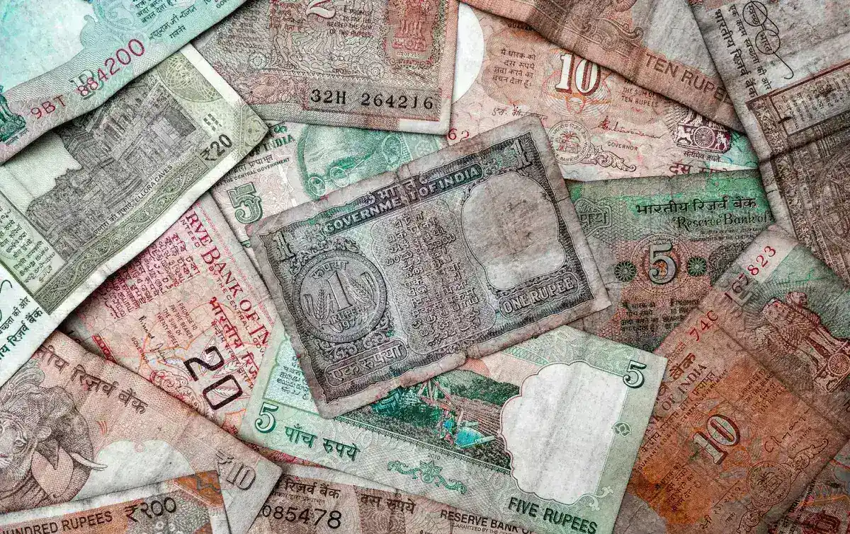 Indian Rupee Plummets to Record Low Amid Soaring Dollar Demand and Crude Prices