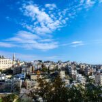 Beautiful panoramic view of Bethlehem cityscape under a vibrant blue sky, showcasing historical architecture.