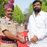 Police officer awarded honorary medal at outdoor ceremony