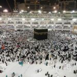 From above of crowded square around Kaaba cube in Great Mosque of Mecca at night time