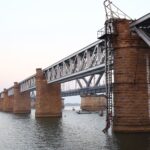 Majestic view of the Havelock Bridge crossing the Godavari River in Rajamahendravaram, India.
