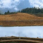 Serene landscape of a tranquil lake surrounded by lush forests in Arunachal Pradesh, India.