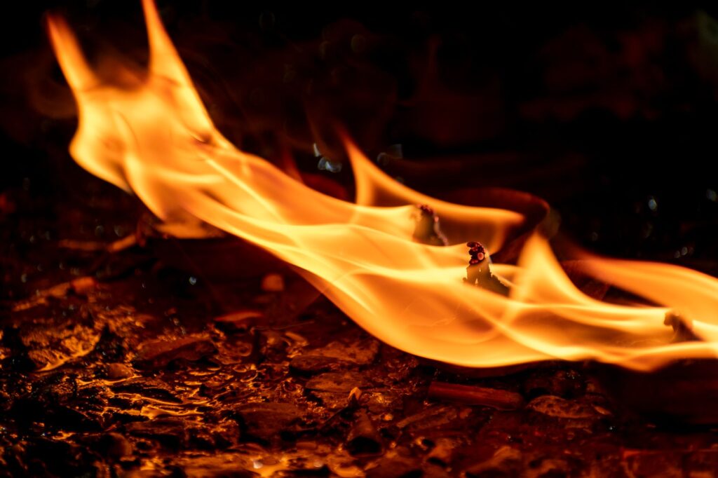 Close view of vibrant flames from oil lamps during Diwali in Kolkata, India.