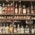 A diverse selection of liquor bottles elegantly displayed on shelves in Valletta, Malta.
