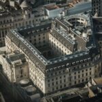 A detailed aerial shot of the historical Bank of England in London, showcasing its grand architecture.