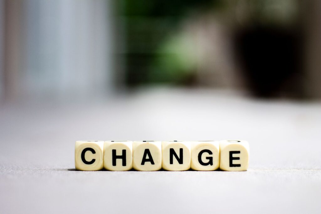 Close-up of letter blocks spelling 'CHANGE', symbolizing transformation and growth.