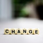 Close-up of letter blocks spelling 'CHANGE', symbolizing transformation and growth.