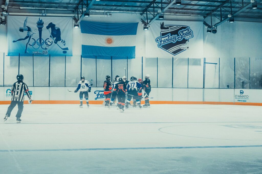 Exciting indoor ice hockey game at Fantasy Skate Club, Buenos Aires, showcasing competitive sports action.