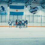 Exciting indoor ice hockey game at Fantasy Skate Club, Buenos Aires, showcasing competitive sports action.