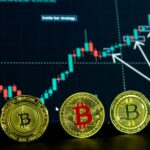 Close-up of Bitcoin coins with a financial trading graph in the background, showcasing digital currency dynamics.
