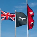 Union Jack, Gurkha and Nepal flags waving in Aldershot, England.