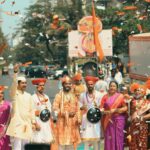 A lively Gudi Padwa festival parade with traditional Marathi attire on a Mumbai street.