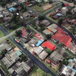 Aerial view showcasing a vibrant residential neighborhood with colorful rooftops.