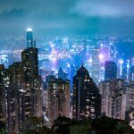 Captivating night view of Hong Kong's skyline, showcasing illuminated skyscrapers and Victoria Harbour.