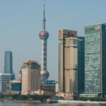 A stunning view of Shanghai's Pudong skyline with the iconic Oriental Pearl Tower and modern skyscrapers.