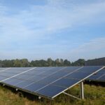 Solar panels in a Ratzeburg field, capturing renewable energy on a clear day.