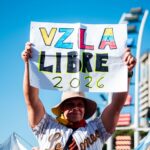 Venezuelan community in Buenos Aires celebrates freedom with signs and flags.