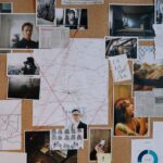 A detailed crime investigation board filled with photos, maps, and red strings connecting clues and evidence.