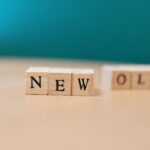 Wooden blocks displaying the words 'NEW' and 'OLD', symbolizing change.