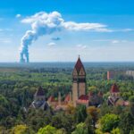Aerial view of Leipzig with prominent incineration plant. Contrasting urban and green scenery.
