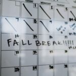Close-up of a whiteboard calendar with 'FALL BREAK' written in bold letters.