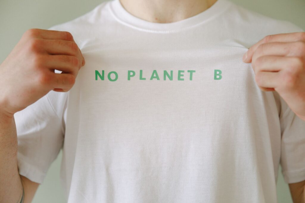 White t-shirt with 'No Planet B' slogan promoting environmental awareness.