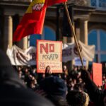 Crowd in Stuttgart demonstrating against AfD with signs and banners.