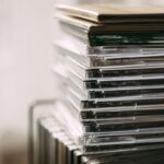A stack of transparent CD cases neatly aligned, creating a still life composition.