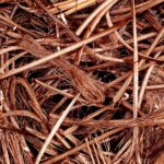 Close-up view of intertwined copper wires ready for recycling, emphasizing industrial reuse.