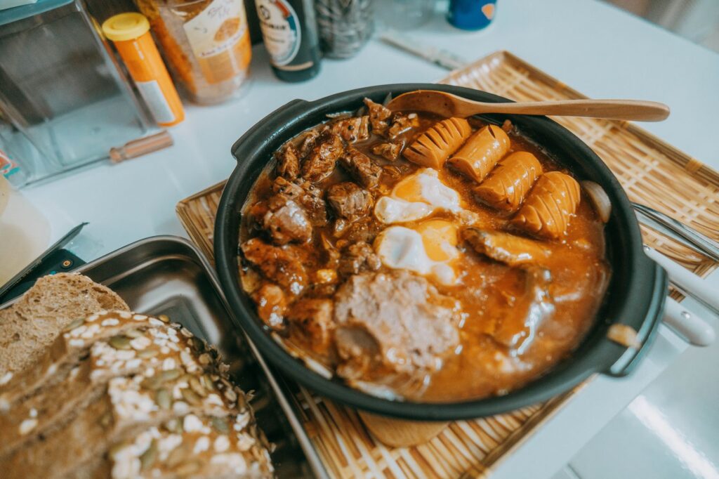 Rustic hearty stew with sausages, eggs, and dark bread. Perfect comfort food.