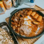 Rustic hearty stew with sausages, eggs, and dark bread. Perfect comfort food.