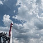 Vostok rocket displayed against a vibrant cloudy sky, showcasing engineering and space exploration.