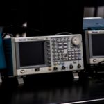 Close-up of electronic measuring equipment in a lab setting, showcasing precision technology.