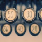 Close-up of a vintage typewriter showcasing numbered keys with a retro feel.