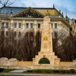 Soviet War Memorial in Budapest with a vintage building backdrop, captured during winter.