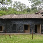 Black textured facade of Kala Bhavana at Visva Bharati University, Santiniketan.