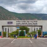 Main entrance of Indian Institute of Technology Tirupati with scenic mountains in background.