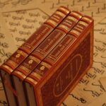 Historic Islamic books on Arabic script, showcasing cultural heritage and traditional calligraphy.