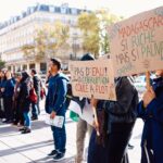 Crowd gathering for a peaceful protest in Paris, raising awareness about Madagascar's political issues.