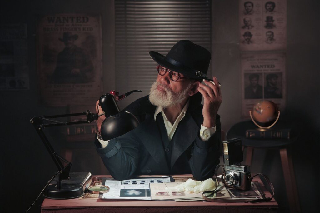 Vintage-styled detective scene with a man in a hat examining papers under a lamp.