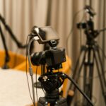 A professional studio with cameras, microphones, and other equipment ready for recording or live streaming.