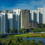 Stunning cityscape of Kochi's modern skyline with high-rise apartments and lush greenery.