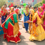 Colorful traditional dance celebration during a vibrant festival in Moga, Punjab, India.