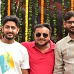 Three friends pose during a vibrant outdoor protest in Ranchi, showcasing cultural pride and unity.