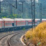 Scenic view of an Indian Railways passenger train passing through Karnataka, India.