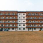 Front view of a modern apartment building in Delhi, India, showcasing unique architectural design.