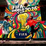 Vibrant mural of FIFA World Cup 2026 with kids playing soccer in the foreground.