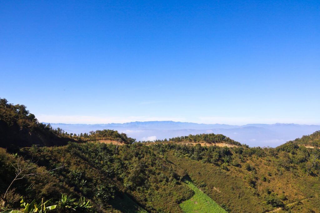 Beautiful view of lush mountains and blue sky in Churachandpur, India.