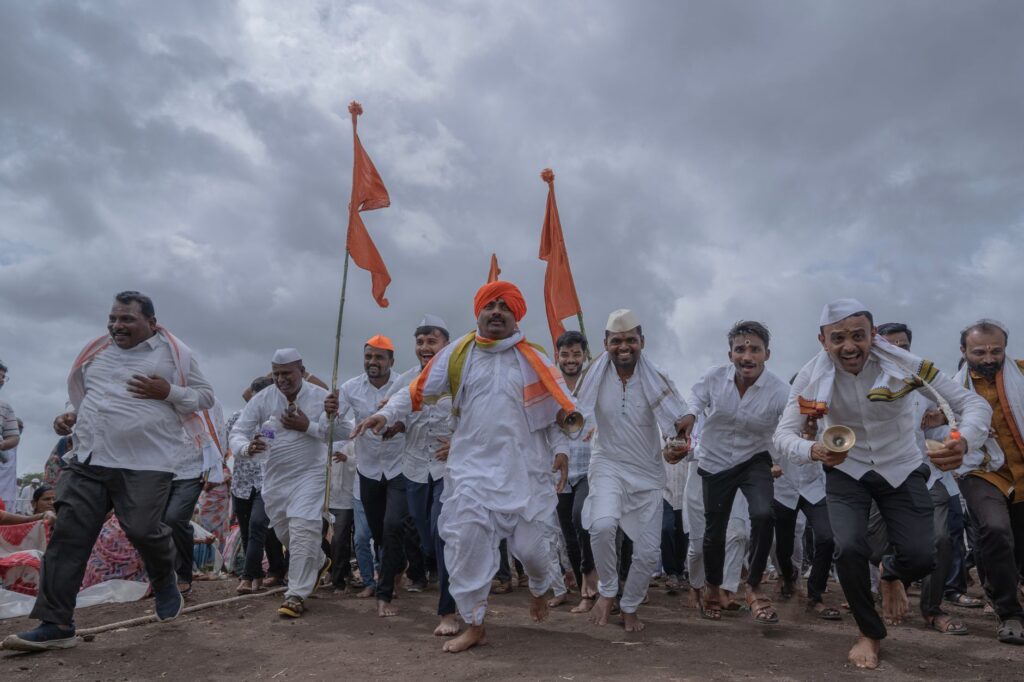 Vibrant cultural celebration with participants in traditional attire at Pandharpur, India.